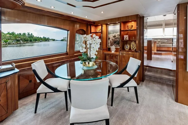 Slide: The Image of Luxurious interior of 2007 Hatteras 80 Motor Yacht with elegant dining area and scenic window view. - 14