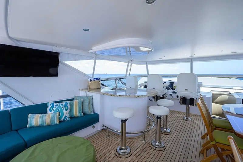 Slide: The Image of Luxurious interior of 2007 Hatteras 80 Motor Yacht with seating and helm station. - 7
