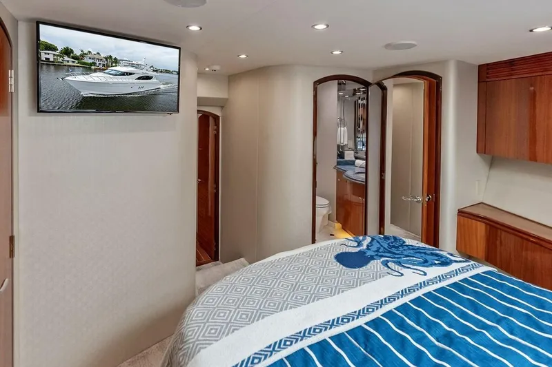 Slide: The Image of Luxurious bedroom interior of 2007 Hatteras 80 Motor Yacht with ensuite bathroom and TV. - 33