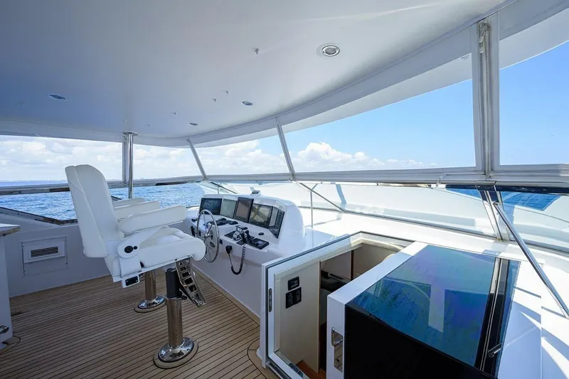 Slide: The Image of Helm of 2007 Hatteras 80 Motor Yacht with ocean view and modern controls. - 8