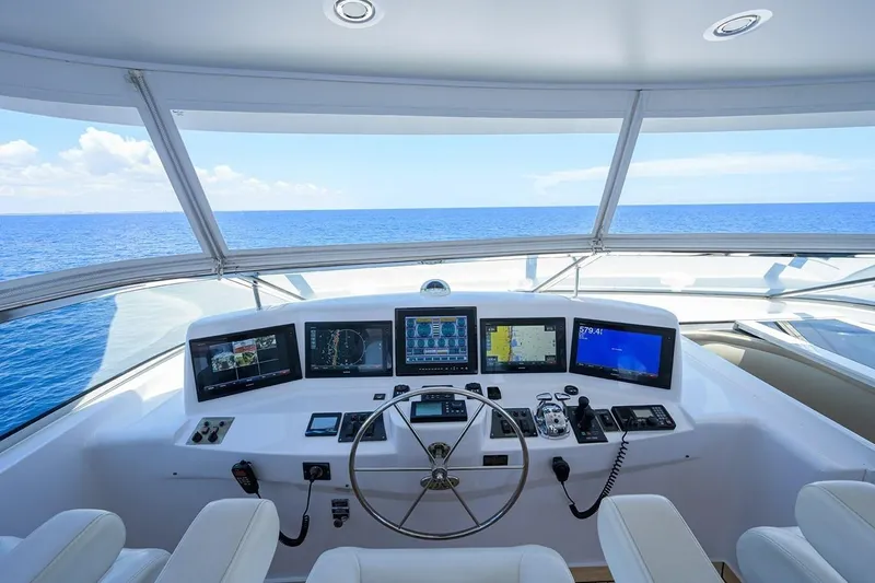Slide: The Image of Helm of 2007 Hatteras 80 Motor Yacht with navigation screens and ocean view. - 9