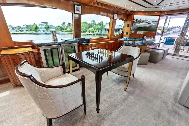 Slide: The Image of Luxurious interior of 2007 Hatteras 80 Motor Yacht with chess set and scenic view. - 12