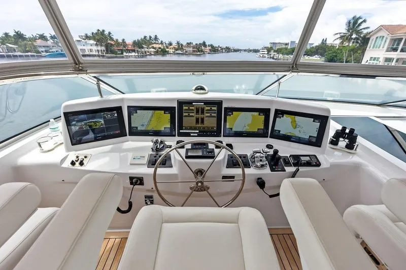 Slide: The Image of Helm of 2007 Hatteras 80 Motor Yacht with advanced navigation systems and luxurious seating. - 42