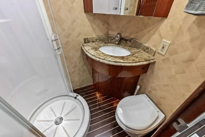 Slide: The Image of Luxurious bathroom in 2007 Hatteras 80 Motor Yacht with shower, sink, and toilet. - 45