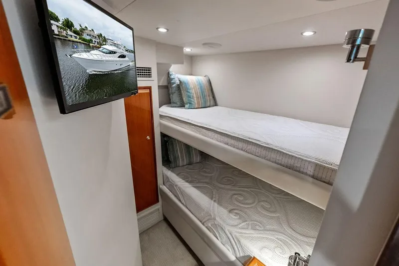 Slide: The Image of Interior of 2007 Hatteras 80 Motor Yacht with bunk beds and wall-mounted TV. - 46