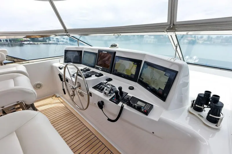 Slide: The Image of Helm of 2007 Hatteras 80 Motor Yacht with navigation screens and controls. - 43