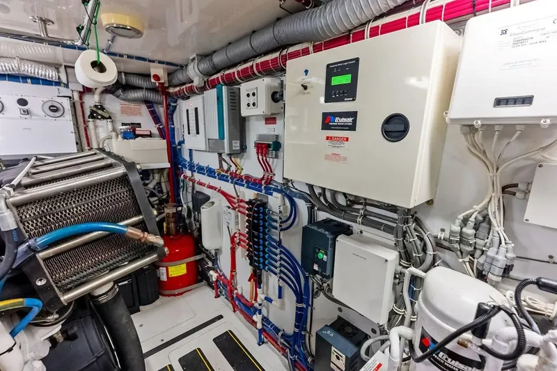 Slide: The Image of Engine room of 2007 Hatteras 80 Motor Yacht with complex wiring and machinery. - 56
