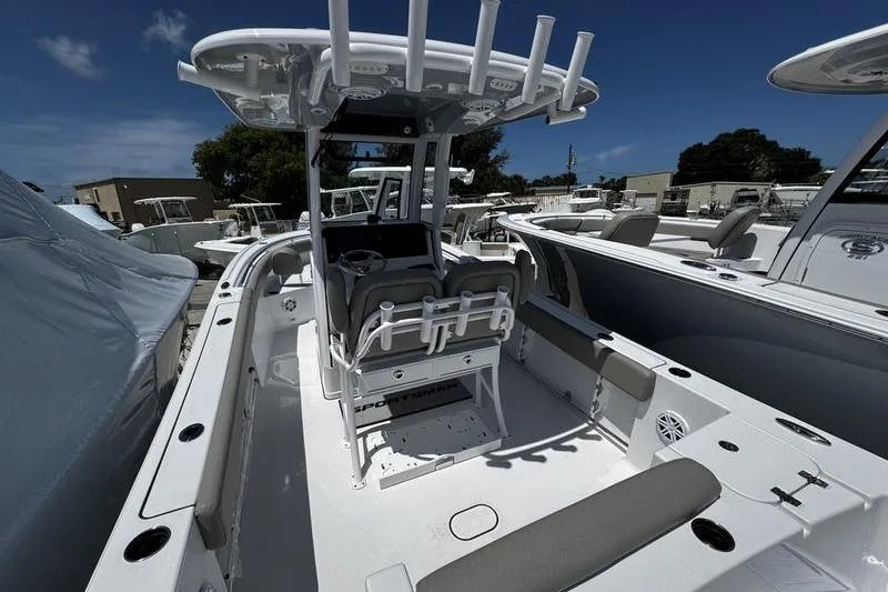 The Image of 2026 Sportsman Open 232 Center Console boat with seating and rod holders. - 0