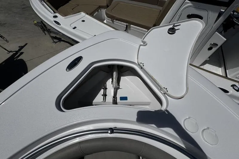 Slide: The Image of Open anchor compartment on 2026 Sportsman Open 232 Center Console boat. - 11