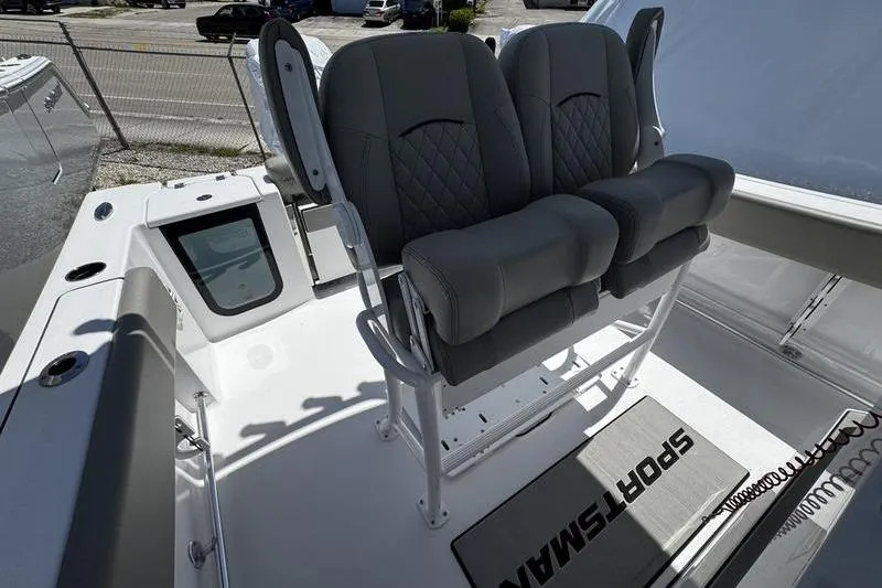 Slide: The Image of 2026 Sportsman Open 232 Center Console boat with dual cushioned seats. - 12
