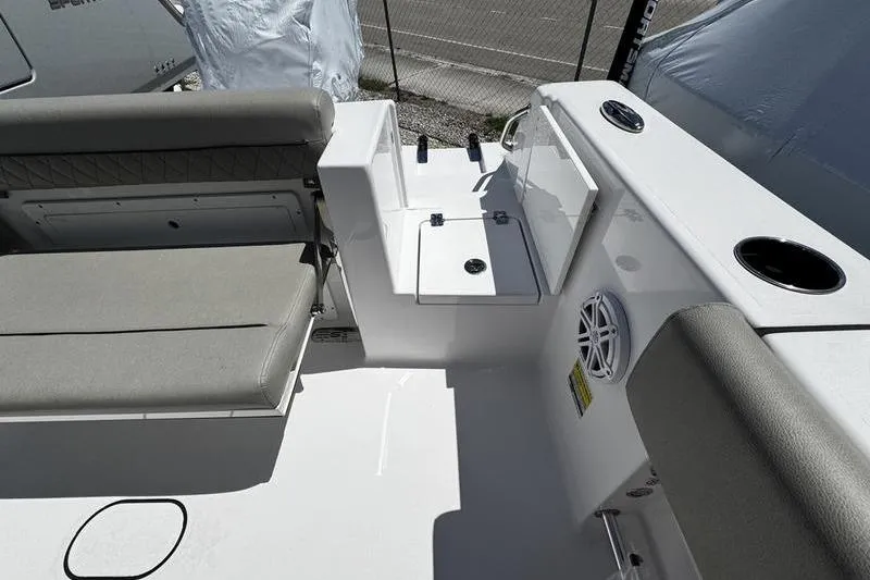 Slide: The Image of 2026 Sportsman Open 232 Center Console boat interior with seating and storage. - 13