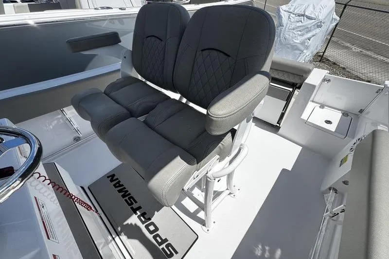 Slide: The Image of 2026 Sportsman Open 232 Center Console boat with dual cushioned seats. - 15