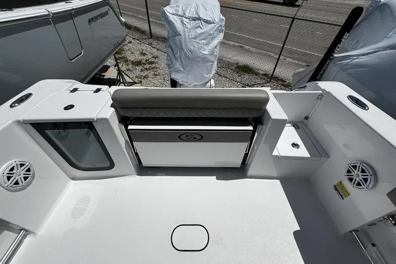 Slide: The Image of 2026 Sportsman Open 232 Center Console boat interior with seating and storage. - 21