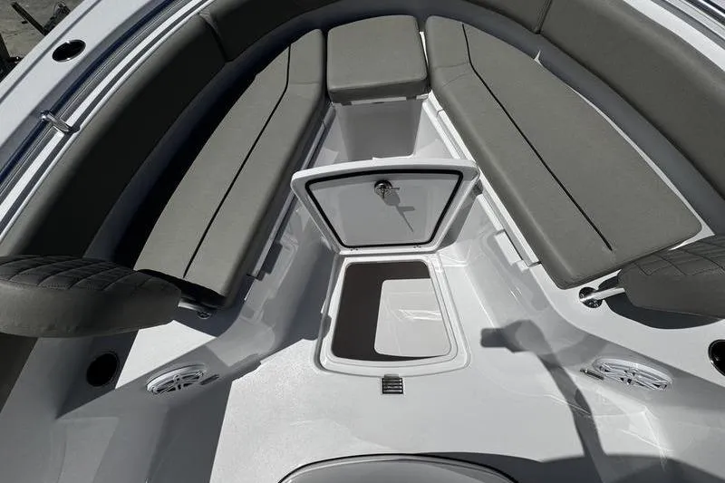 Slide: The Image of 2026 Sportsman Open 232 Center Console boat interior with seating and storage. - 25