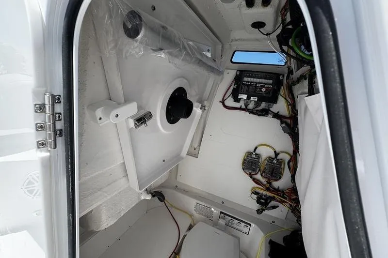 Slide: The Image of Interior view of 2026 Sportsman Open 232 Center Console boat, showcasing wiring and equipment. - 4