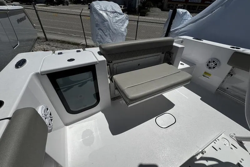 Slide: The Image of 2026 Sportsman Open 232 Center Console boat interior with seating and storage. - 5