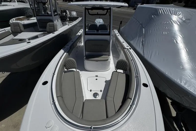 Slide: The Image of 2026 Sportsman Open 232 Center Console boat with sleek design and spacious seating. - 7