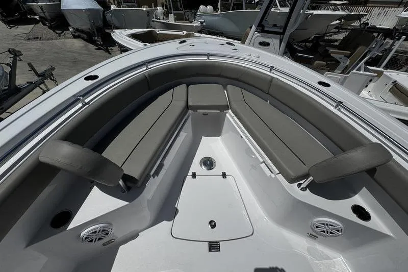 Slide: The Image of 2026 Sportsman Open 232 Center Console boat interior with cushioned seating. - 9