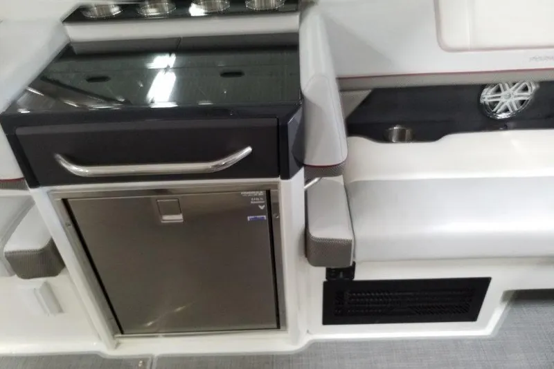 Slide: The Image of Interior of 2020 Formula 330 Crossover Bowrider with seating and storage features. - 10