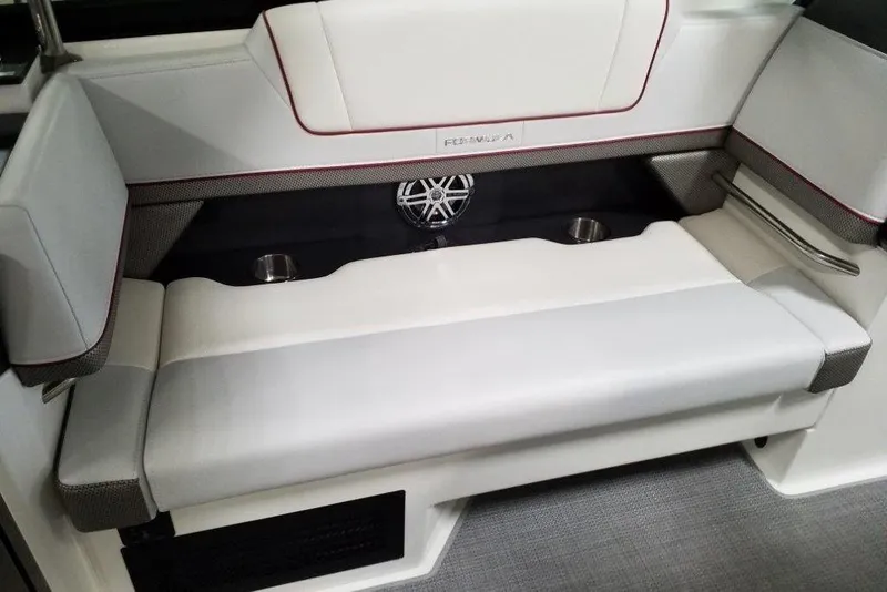 Slide: The Image of 2020 Formula 330 Crossover Bowrider interior seating with cup holders and speaker. - 11