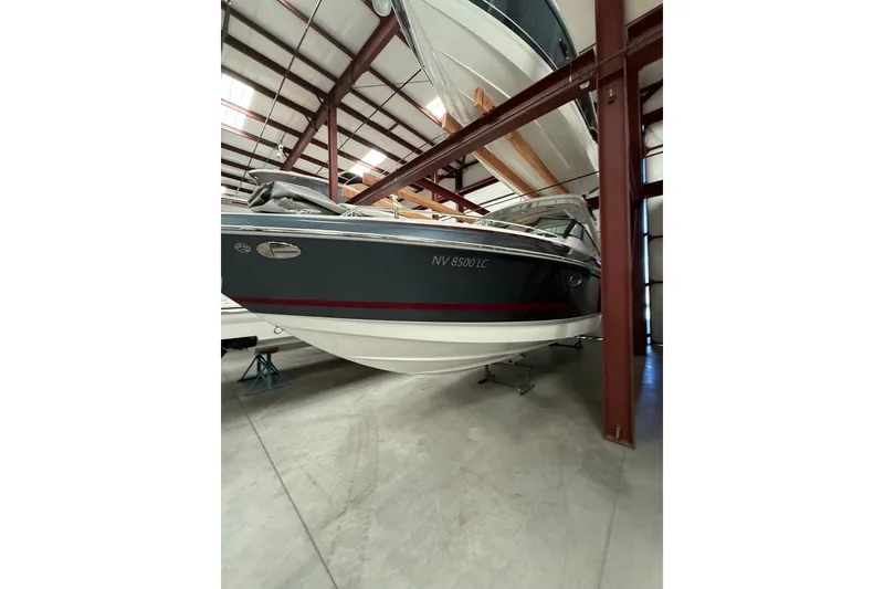 Slide: The Image of 2020 Formula 330 Crossover Bowrider in storage facility, side view. - 3