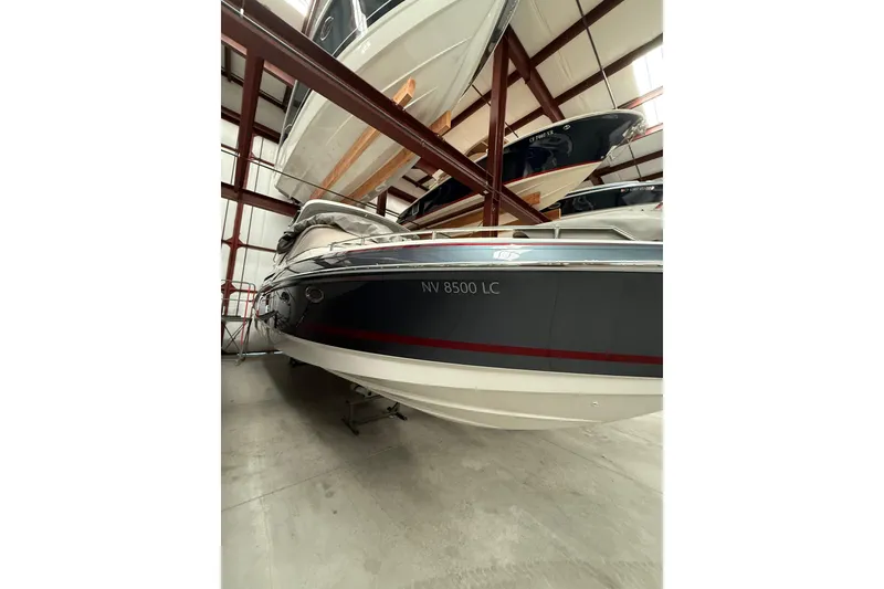 Slide: The Image of 2020 Formula 330 Crossover Bowrider in indoor storage facility. - 4