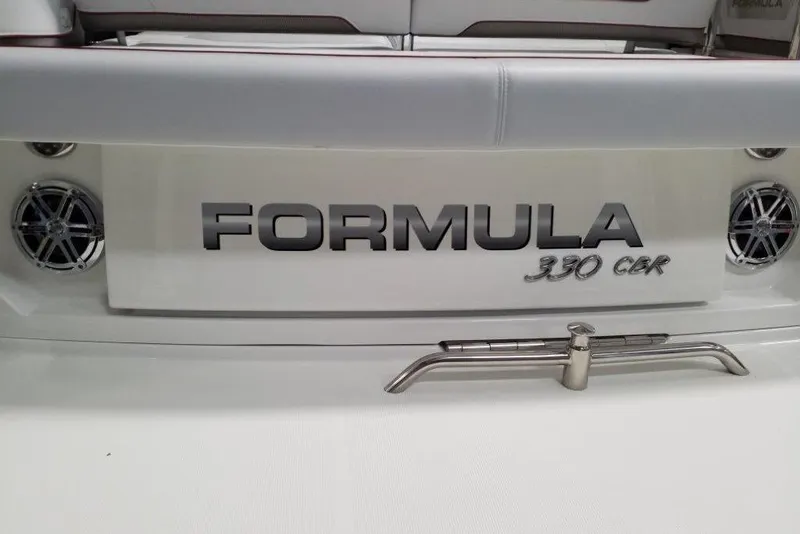Slide: The Image of 2020 Formula 330 Crossover Bowrider boat logo on rear deck with speakers. - 5