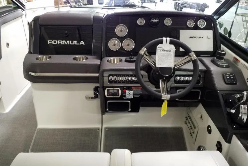 Slide: The Image of Cockpit of 2020 Formula 330 Crossover Bowrider with steering wheel and control panel. - 8