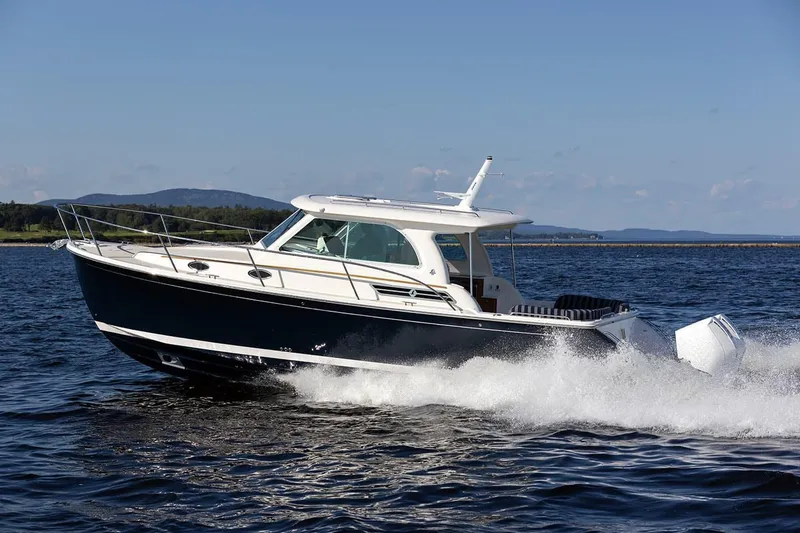 Slide: The Image of Manufacturer Provided Image: 2026 Back Cove 34O cruising on open water, showcasing sleek design and powerful performance. - 1