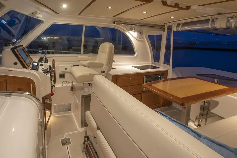 Slide: The Image of Manufacturer Provided Image: Luxurious interior of 2026 Back Cove 34O yacht with elegant seating and modern helm. - 5