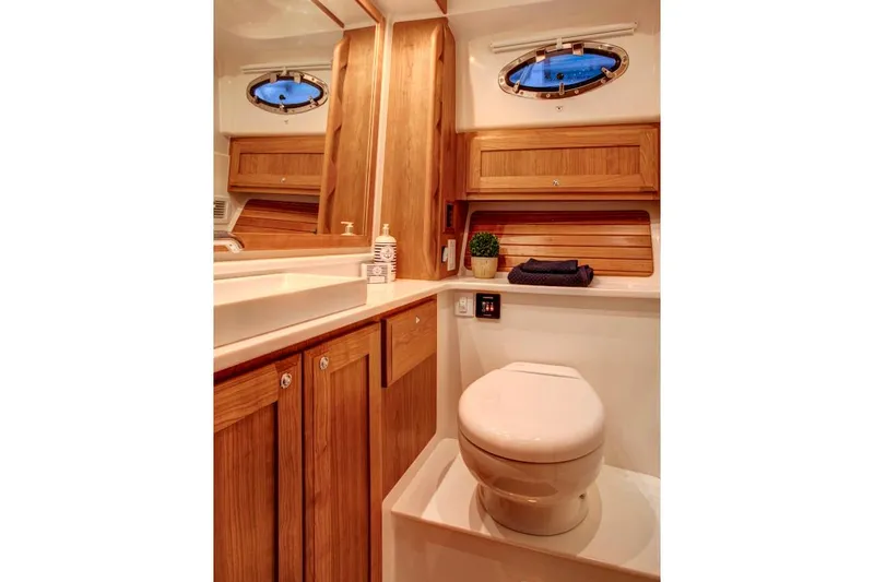 Slide: The Image of Manufacturer Provided Image: Luxurious bathroom in 2026 Back Cove 34O yacht with wooden cabinetry and modern fixtures. - 9