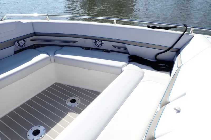 Slide: The Image of 2022 Formula 400 Super Sport Crossover boat interior with white seating and water view. - 14
