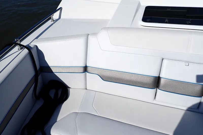 Slide: The Image of 2022 Formula 400 Super Sport Crossover boat interior with sleek white seating and blue accents. - 16
