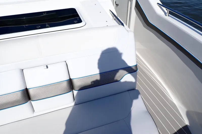 Slide: The Image of 2022 Formula 400 Super Sport Crossover boat interior with white seating and blue accents. - 17