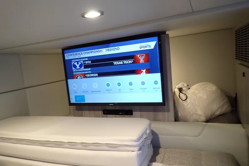 Slide: The Image of Interior of 2022 Formula 400 Super Sport Crossover with TV displaying sports schedule. - 21