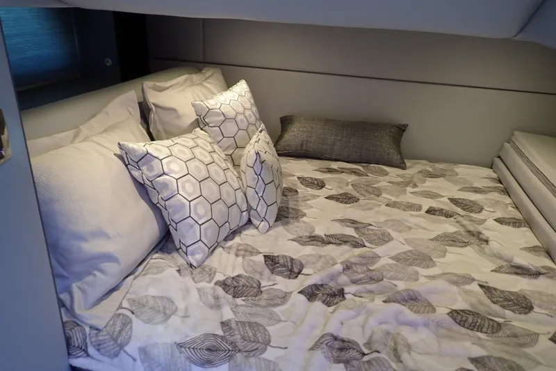 Slide: The Image of Luxurious cabin interior of 2022 Formula 400 Super Sport Crossover with plush bedding and pillows. - 22