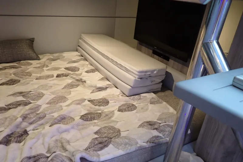Slide: The Image of Interior cabin of 2022 Formula 400 Super Sport Crossover with bed and TV setup. - 23