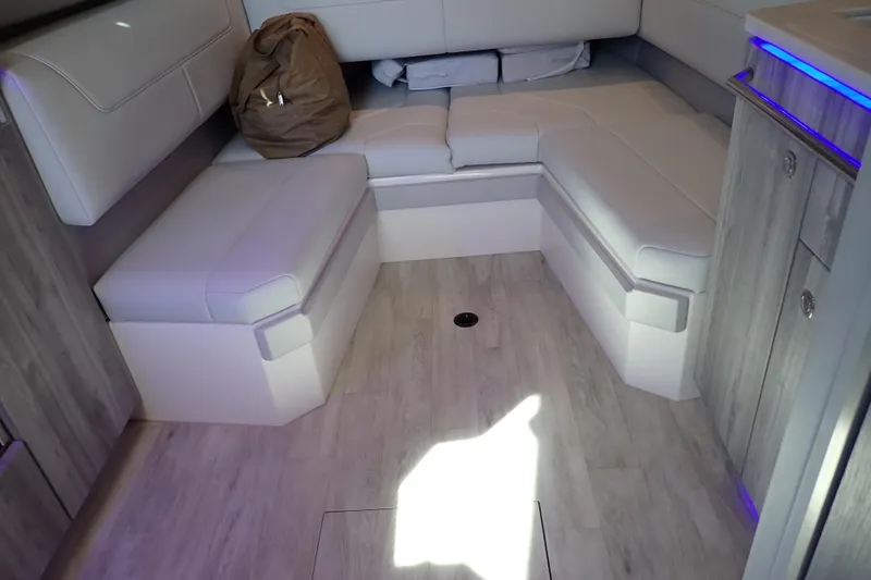 Slide: The Image of Interior of 2022 Formula 400 Super Sport Crossover with white seating and modern design. - 25