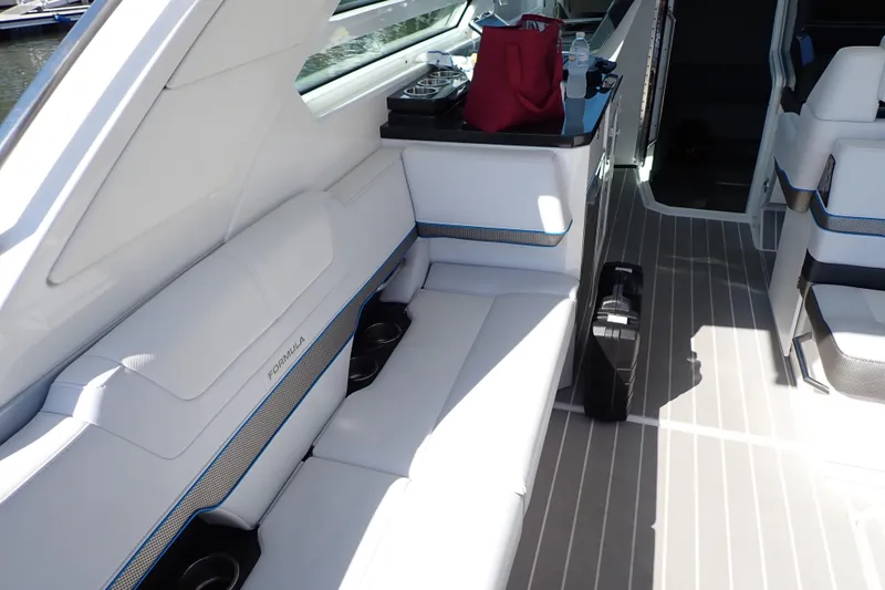 Slide: The Image of Interior of 2022 Formula 400 Super Sport Crossover boat with white seating and modern design. - 30