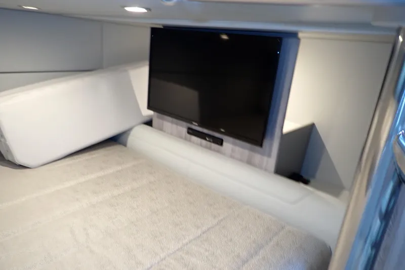 Slide: The Image of Interior of 2022 Formula 400 Super Sport Crossover with TV and cozy bedding. - 7