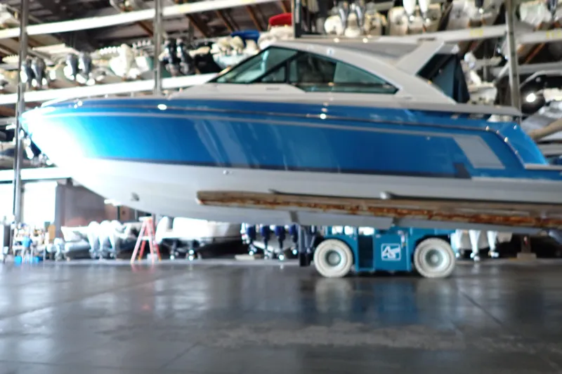 Slide: The Image of 2022 Formula 400 Super Sport Crossover boat in storage facility, side view. - 8