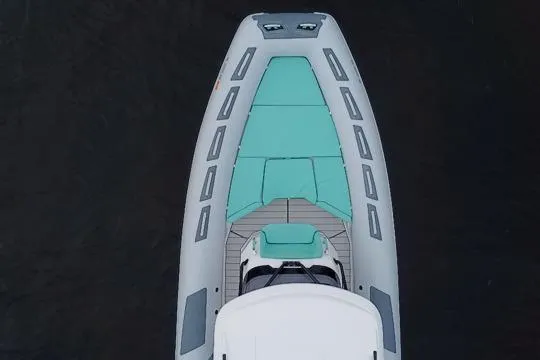 Slide: The Image of Top view of 2024 Ranieri Cayman 27.0 Sport boat with teal seating and sleek design. - 13