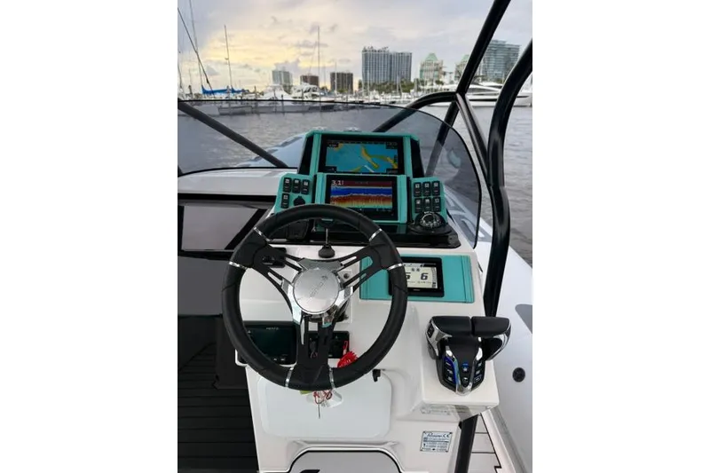 Slide: The Image of 2024 Ranieri Cayman 27.0 Sport helm with advanced navigation systems and controls. - 17