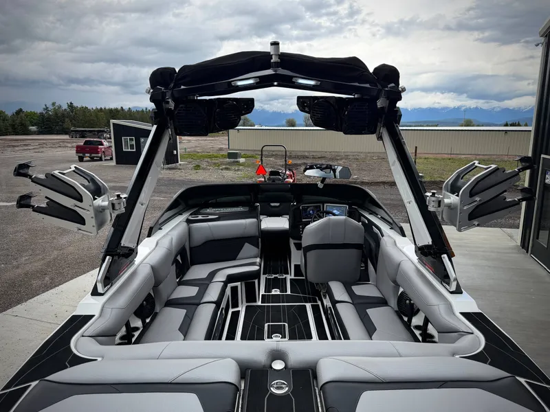 Slide: The Image of Interior view of 2023 Centurion Ri230 boat with luxurious seating and features. - 11