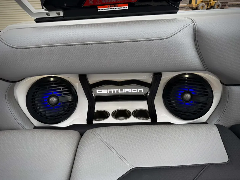 Slide: The Image of 2023 Centurion Ri230 boat speakers with blue lighting. - 14