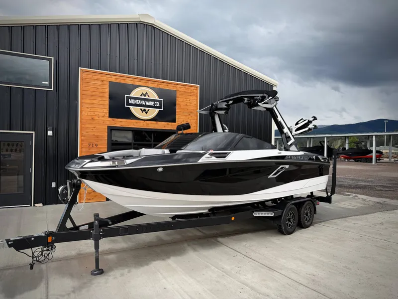 Slide: The Image of 2023 Centurion Ri230 boat in front of Montana Wake Co. building. - 3