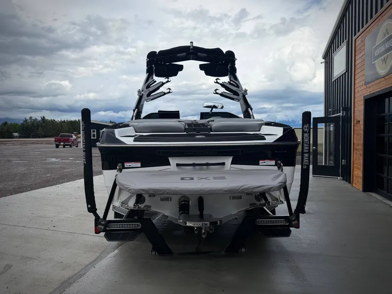 Slide: The Image of 2023 Centurion Ri230 boat parked in front of a building. - 6