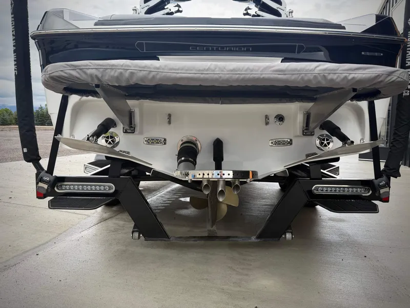 Slide: The Image of Rear view of a 2023 Centurion Ri230 boat on a trailer. - 7