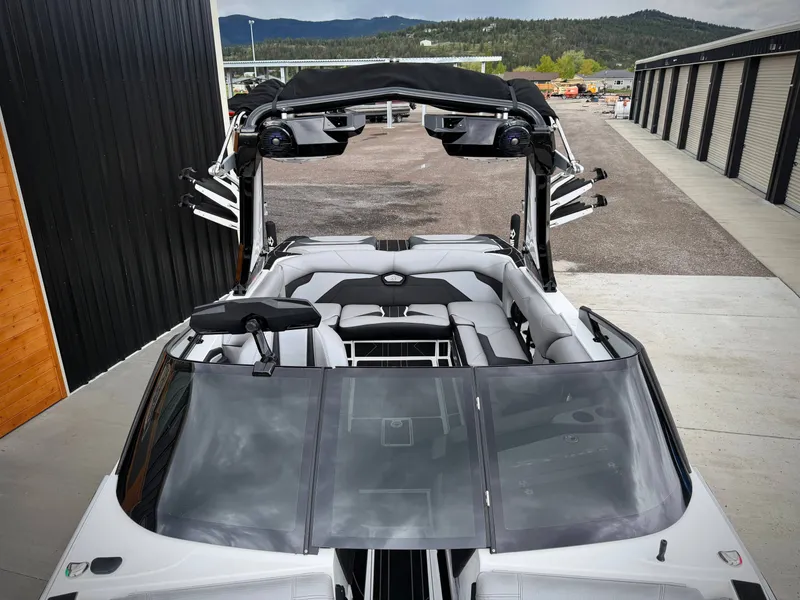 Slide: The Image of 2023 Centurion Ri230 boat with sleek design and luxurious interior. - 8