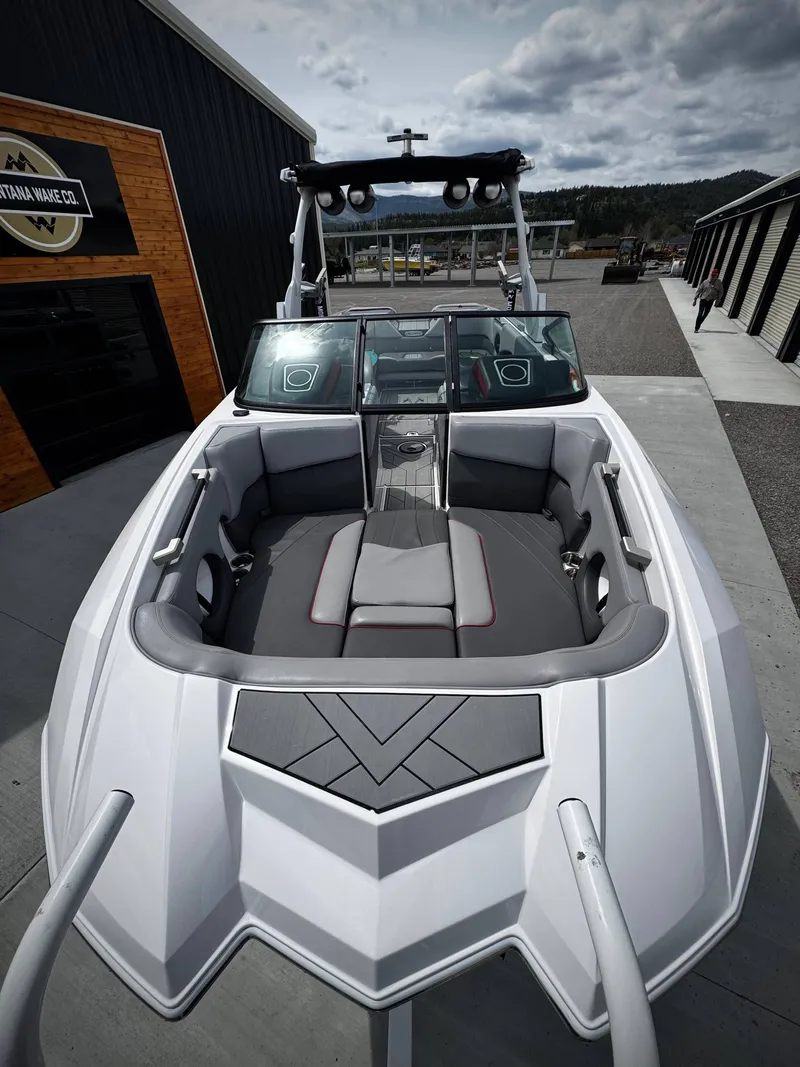 Slide: The Image of 2020 Supra SE 550 boat with sleek design and gray upholstery. - 4